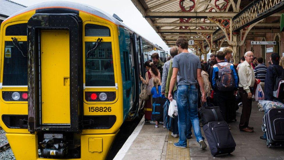 passengers boarding train