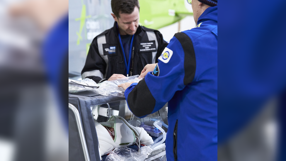 Medics using the new incubator