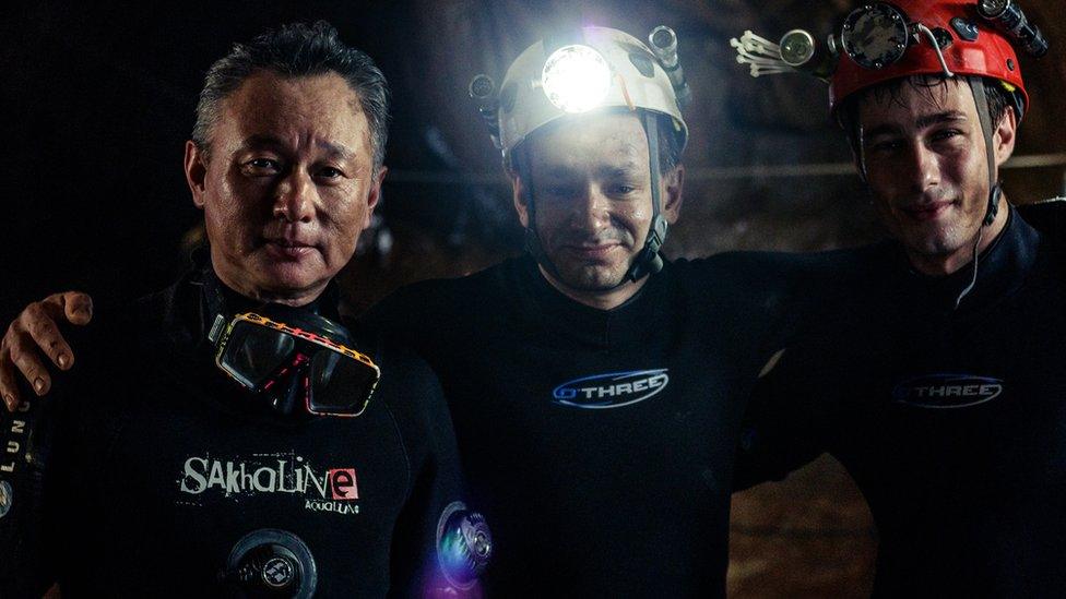 Cave divers Tan Xiaolong, Jim Warny and actor Alex Winslow on the set of The Cave