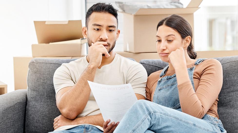 Couple looking at a bill