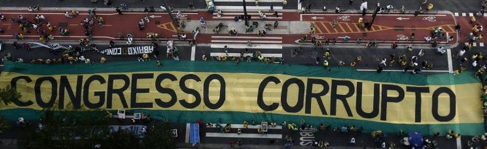 his file photo taken on December 04, 2016 shows demonstrators protest along Paulista Avenue in Sao Paulo, Brazil on December 4, 2016 against corruption and in support of the Lava Jato anti-corruption operation that investigates the bribes scandal of Petrobras.