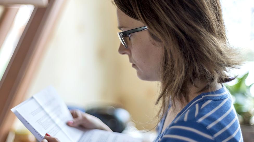 Woman looking at energy bill