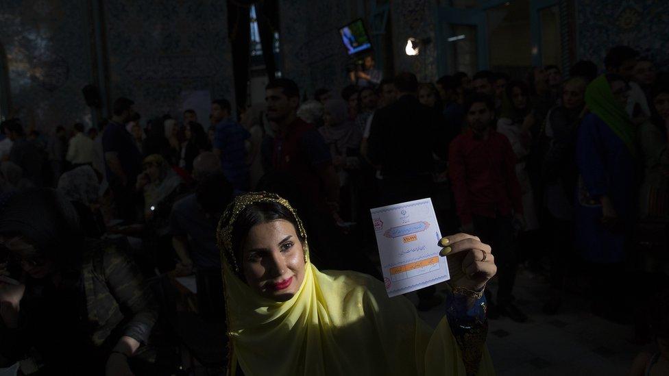 Woman holds her voting slip in Tehran, Iran - 19 May 2017