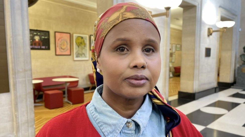 Fatima looking at the camera standing inside City Hall in Bristol