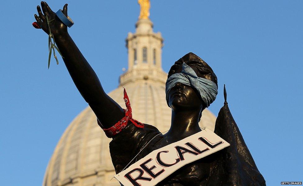 A recall protest sign at the state capitol