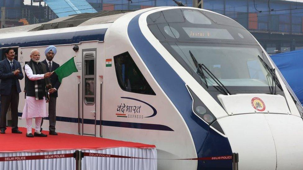 In this photo taken on February 15, 2019, Indian Prime Minister Narendra Modi (2nd L) flags off India's first semi-high speed express train Vande Bharat Express at New Delhi Railway Station. - India's first semi-high speed express train February 16 broke down on the tracks for hours after it crashed into cattle, a day after being flagged off by Prime Minister Narendra Modi.