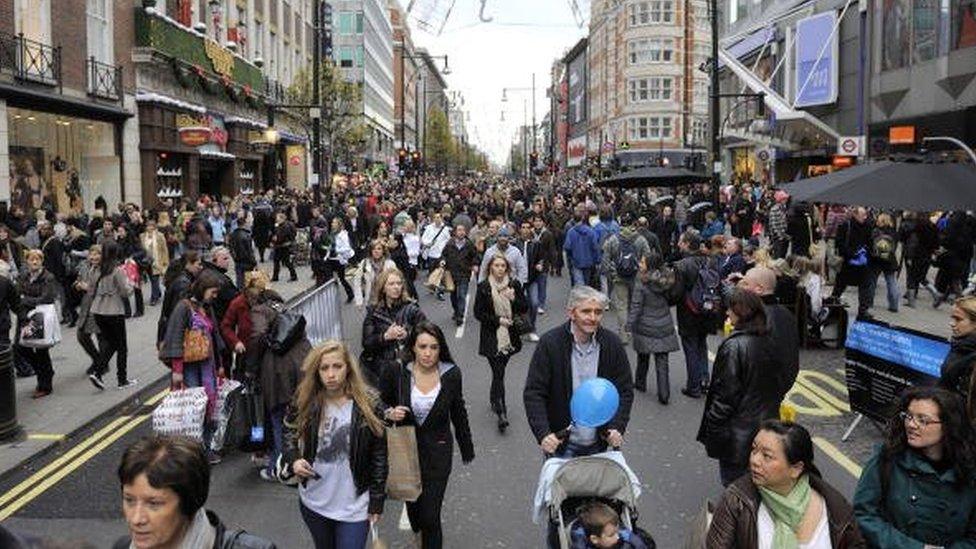 Shoppers walking up Oxford Street