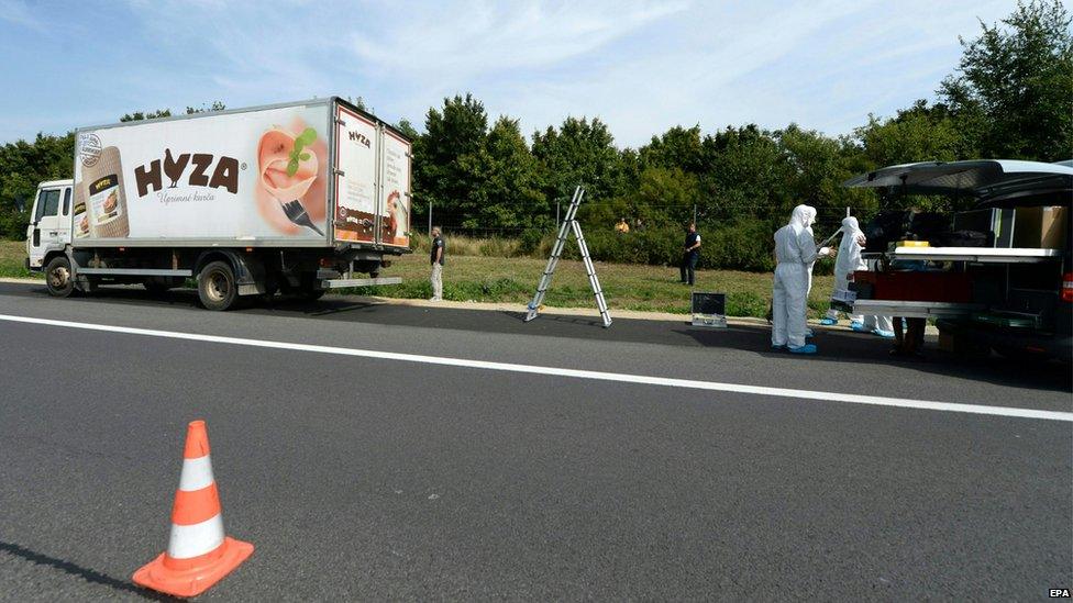 Forensic experts investigate a lorry in which refugees were found dead on autobahn A4 between Parndorf and Neusiedl, Austria, 27 August 2015