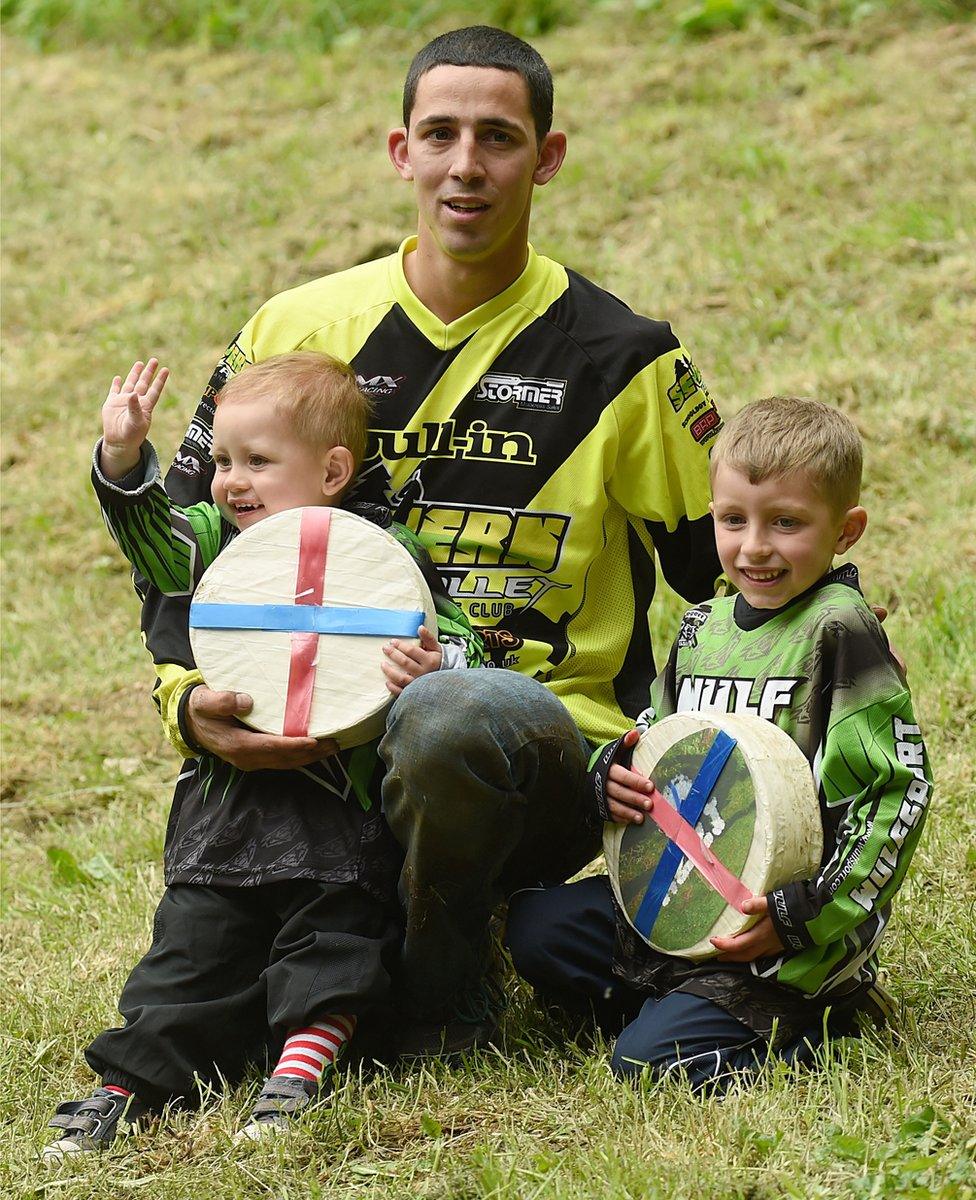 Cheese rolling victor, Chris Anderson, on Cooper's Hill at Brockworth, Gloucestershire