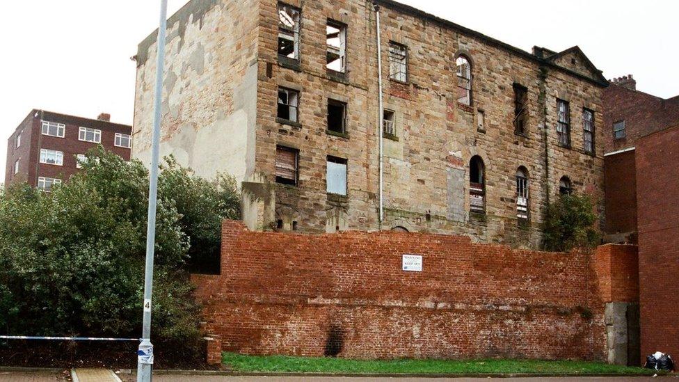 Photograph of large derelict building