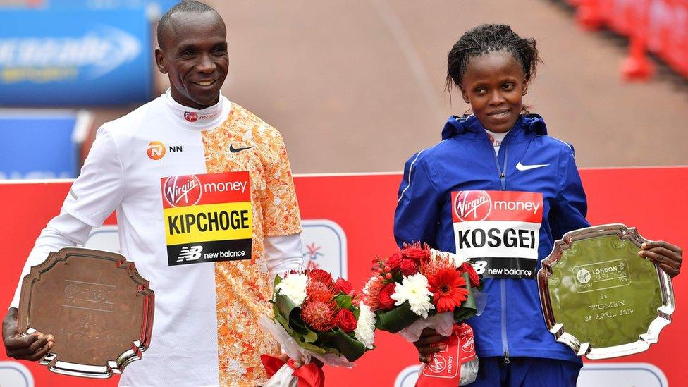 Winners of the elite races at London Marathon 2019 Men's race winner Kenya's Eliud Kipchoge (L) and women's race winner, Kenya's Brigid Kosgei