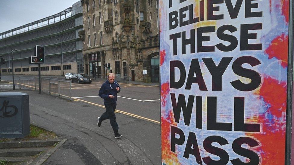 A coronavirus poster saying 'Please Believe These Days Will Pass'