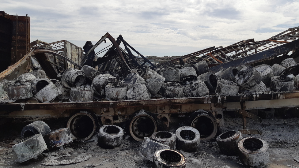 The destroyed trailers and tyres