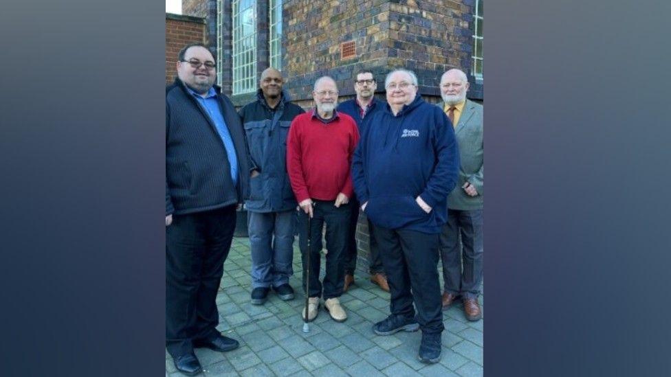 A group of staff outside Chilvers Coton Heritage Centre