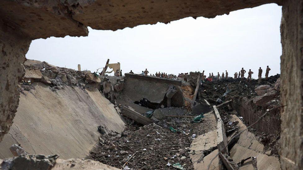 Soldiers looking at a crater at the army deport in N'Djamena lasts at a military ammunition depot in N'Djamena, Chad June 19, 2024.