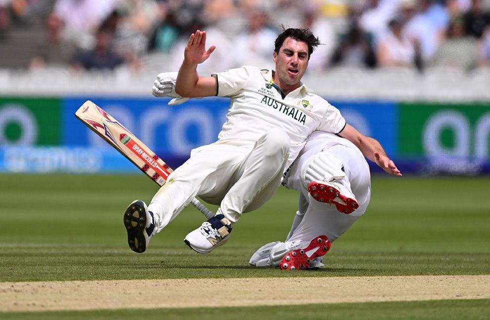 Australia's Pat Cummins collides with Kyle Verreynne of South Africa whilst successfully appealing for his wicket at Lord's Cricket Ground in London. Photo by Mike Hewitt