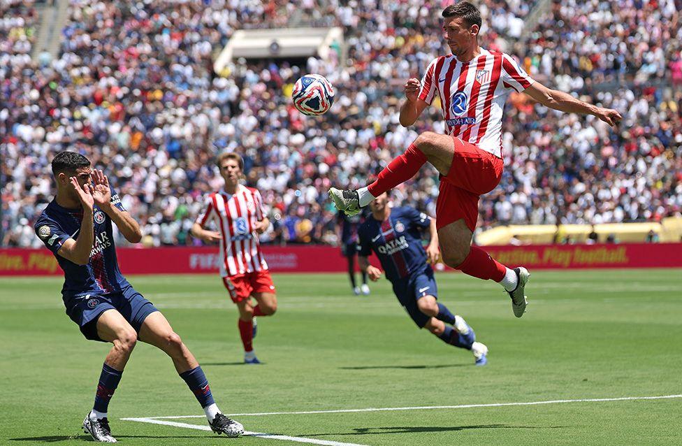 Atletico Madrid's Clement Lenglet clears the ball while under pressure from Paris Saint-Germain's Achraf Hakimi during the FIFA Club World Cup in Pasadena, California. Photo by Harry How