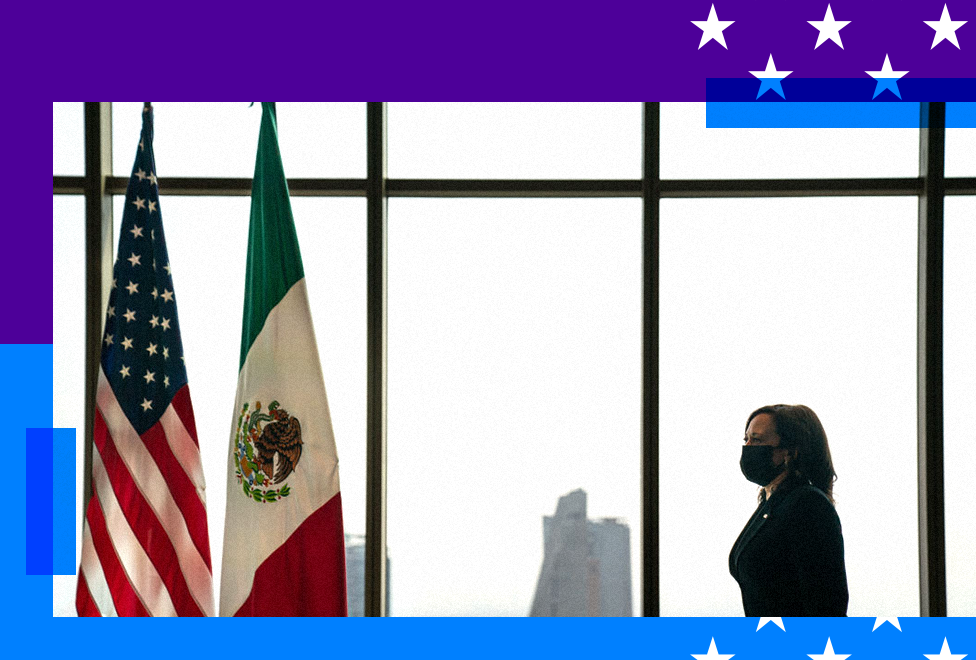 Kamala Harris walks toward two flags - the American flag and Mexican flag 