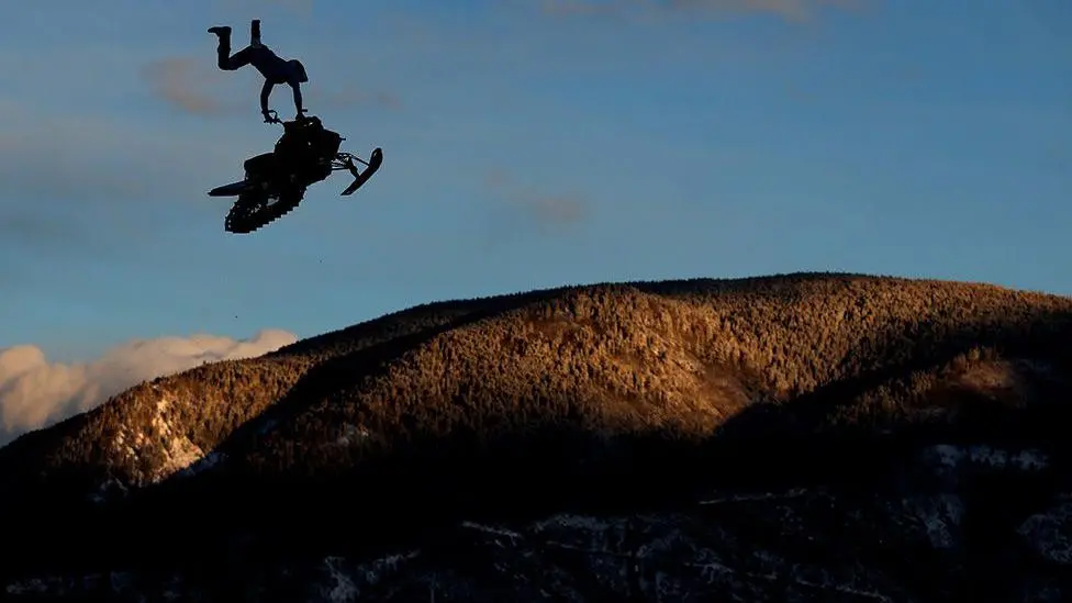 Canada's Brett Turcotte goes airborne during the seeding session for the Snowmobile Speed and Style event at the X Games in Aspen, Colorado. Photo by Jamie Squire