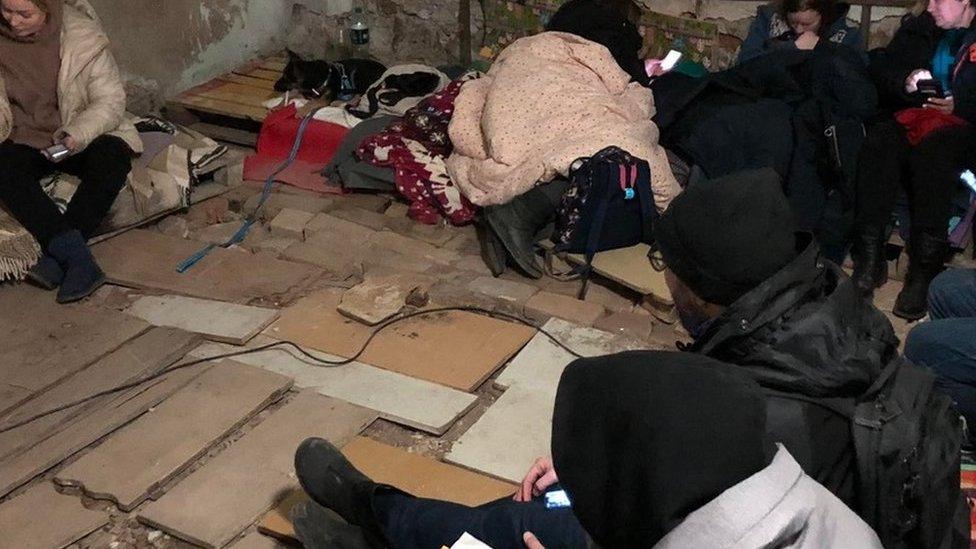 Ukrainian civilians sheltering in basement