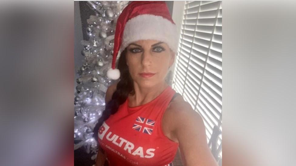 Runner Tracy Halligan dressed in Santa hat