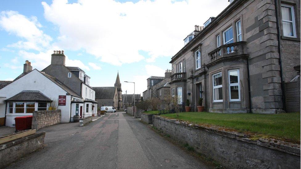 The Wilsons' house with the hotel behind