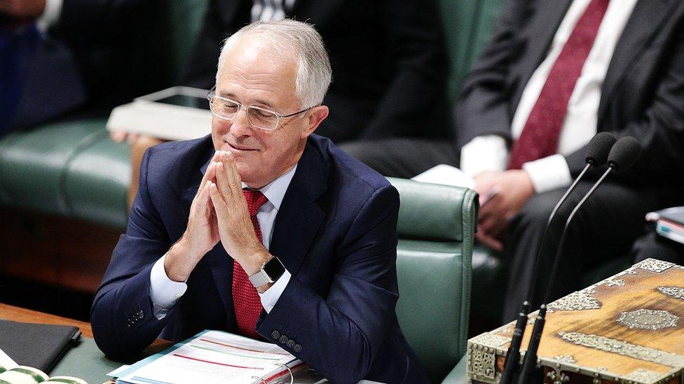 Malcolm Turnbull presses his hands together as though praying