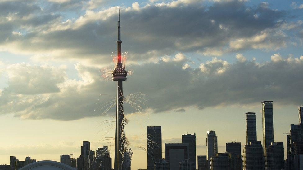 Fireworks are let off off from the CN Tower in Toronto during the opening ceremony for the 2015 Pan American Games on 10 July 2015.