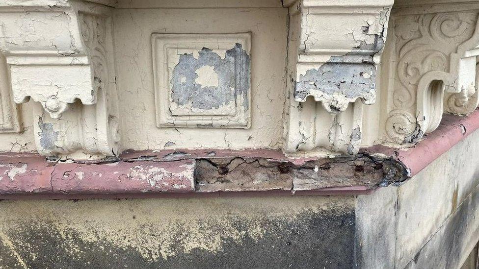 Damaged corbels on the building