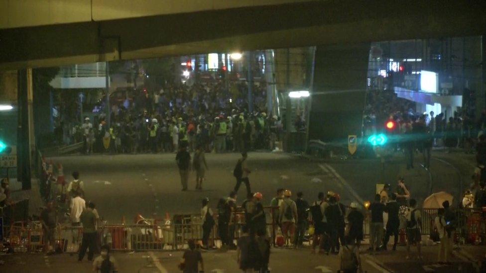 protesters on the street after nightfall June 12