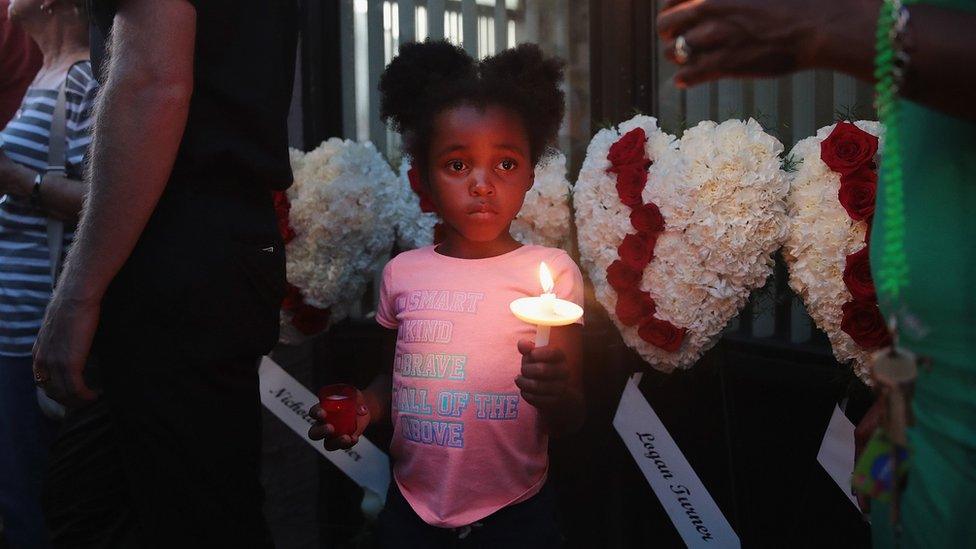 Six-year-old Mariah attends a memorial service with her mother Kristie Holt in the Oregon District to recognize the victims of an early-morning mass shooting in the popular nightspot on August 04, 2019 in Dayton, Ohio