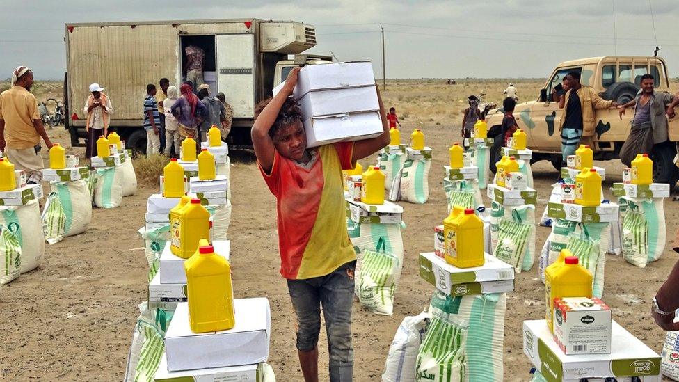 A boy transports food in the village of Hays near Yemen