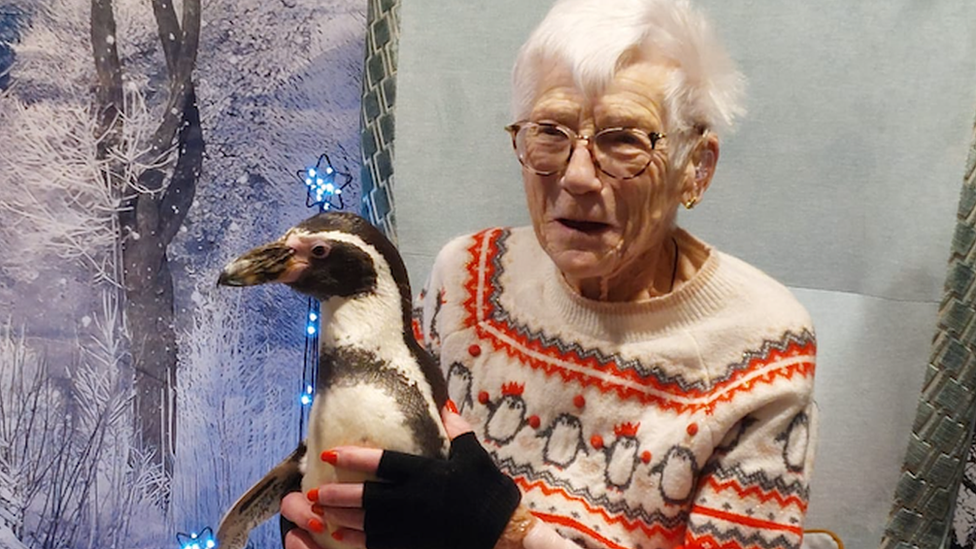 Care home resident with penguin