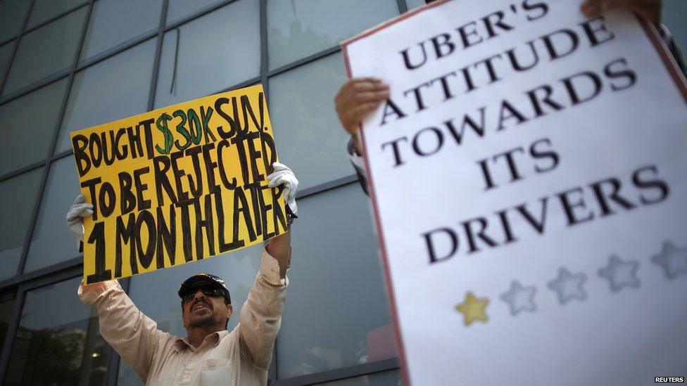 Drivers with Uber protest against working conditions outside the company's office in California