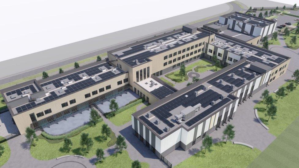 An aerial CGI view of a new school, which is beige and white in colour. Patches of grass are dotted around with a number of trees.