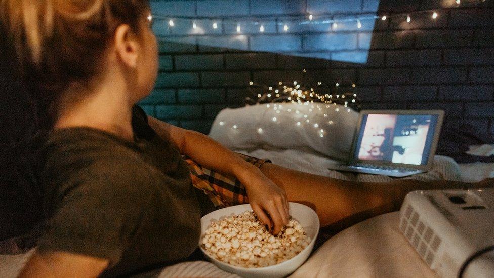 woman watching movie on laptop