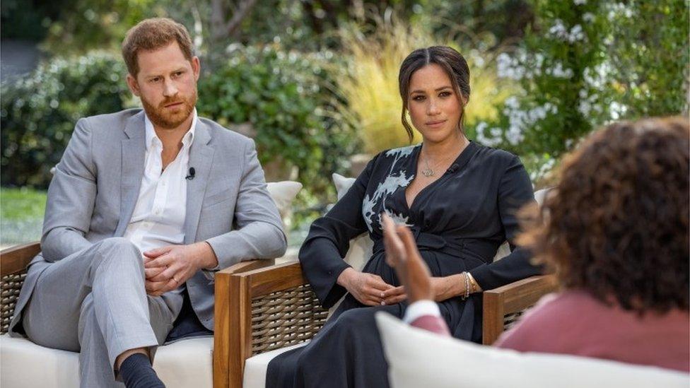 Prince Harry and Meghan, Duchess of Sussex, being interviewed by Oprah Winfrey