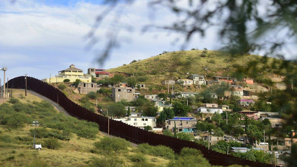 The border of the US-Mexico (houses and hills)