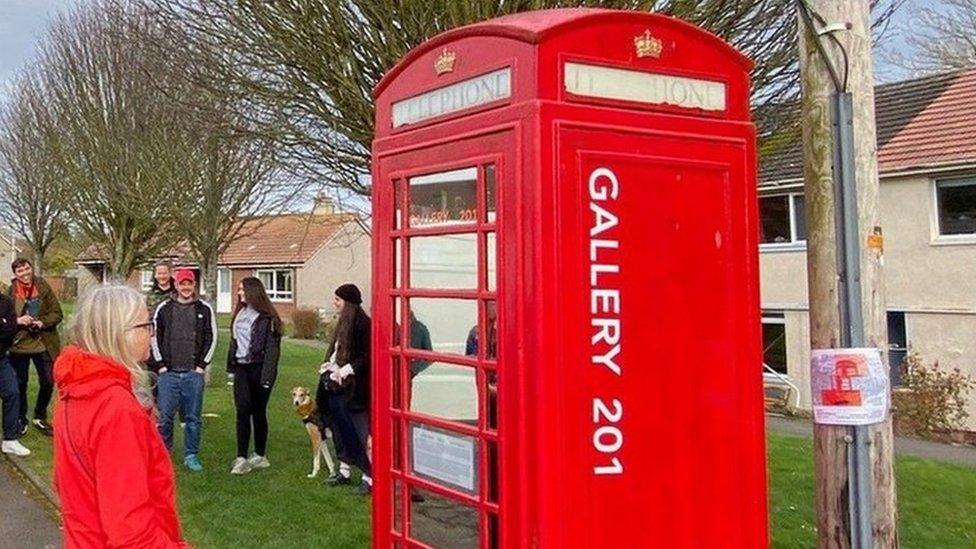 Artist Lada Wilson at the 201 Telephone Box Gallery near St Andrews