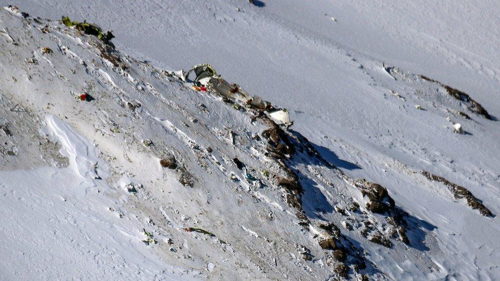 The wreckage of a plane that crashed near a mountain peak two days earlier in Iran's Zagros mountain range.