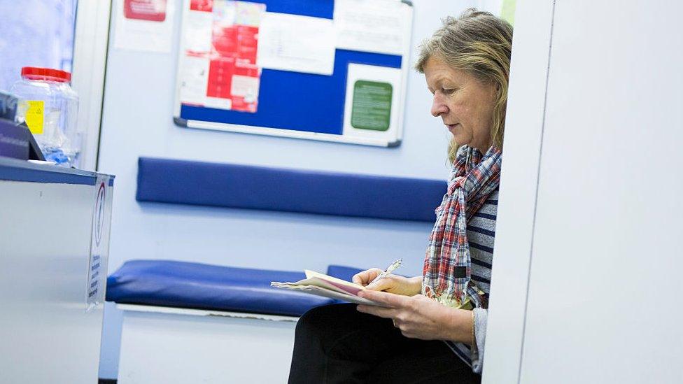 Health worker with notes