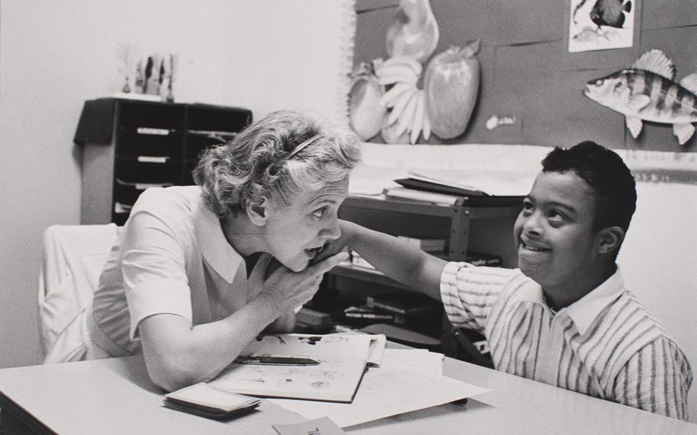 Moneta Sleet's son, Mike, with a teacher at a special needs school