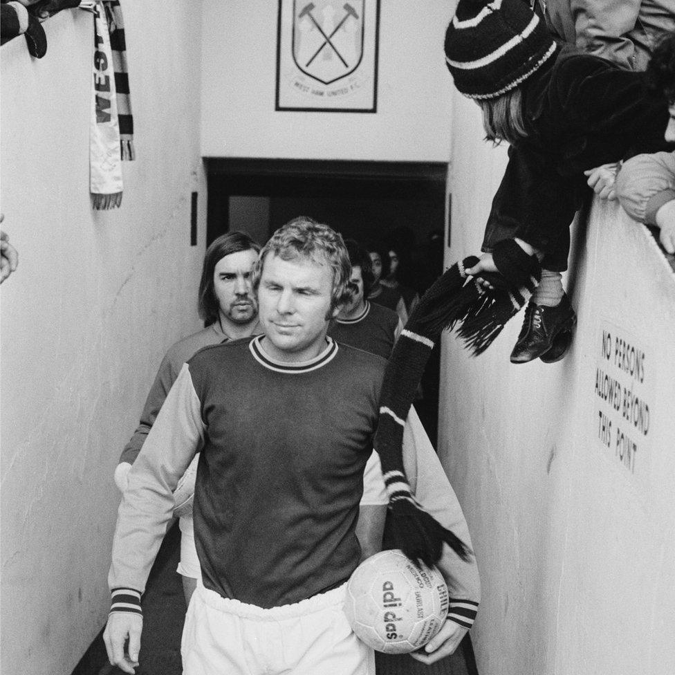 Bobby Moore leading his team out before his last match at the ground,, on 9 March 1974