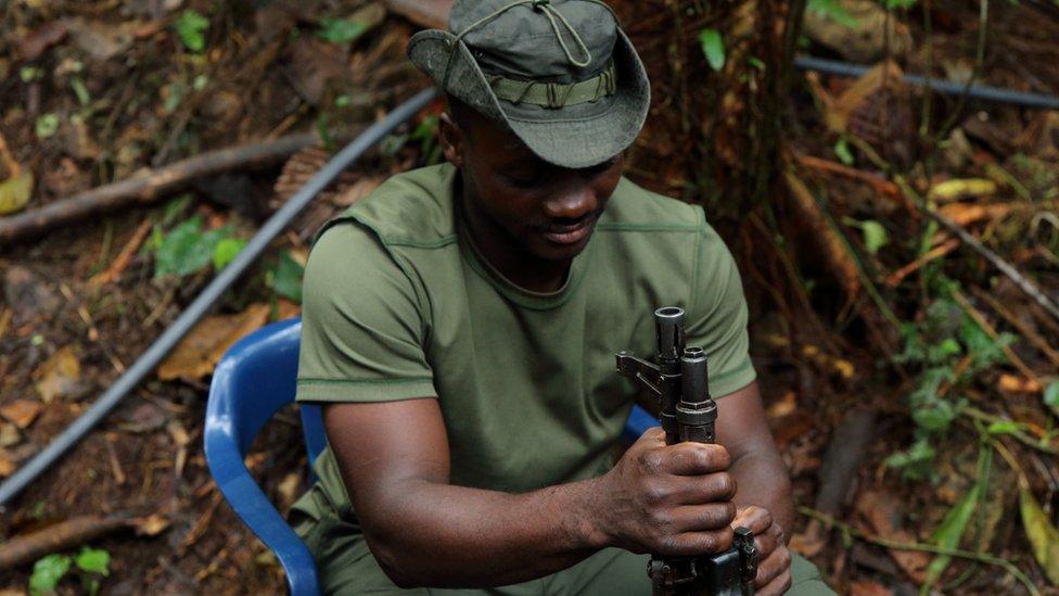 Rebels cleaning their guns