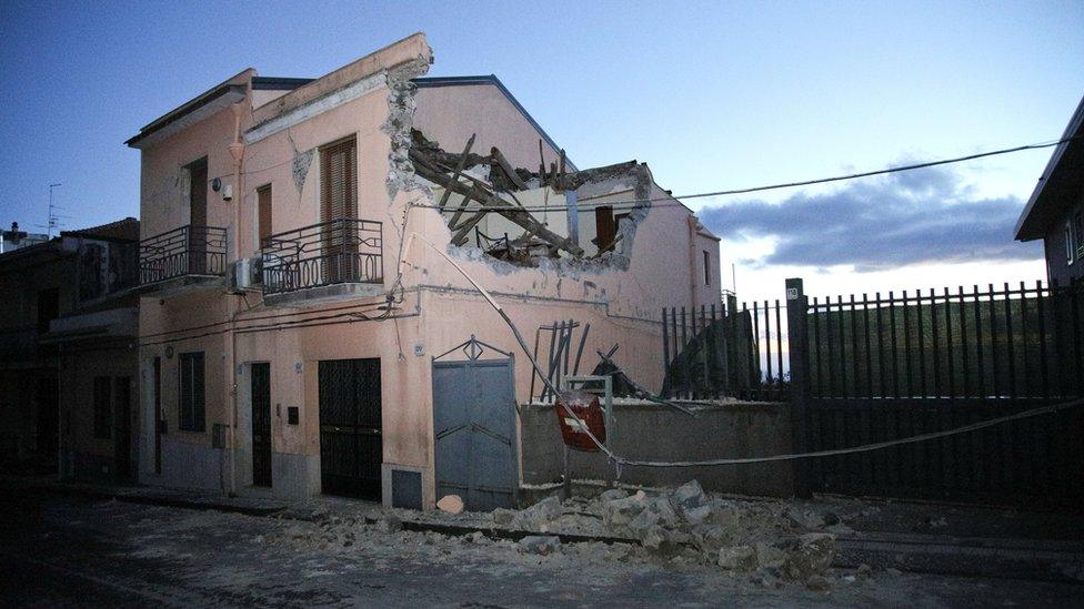 A house is seen damaged by an earthquake at the area north of Catania