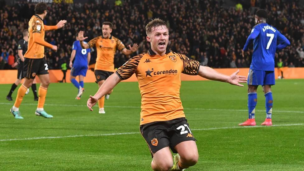 Joe Gelhardt sliding on his knees to celebrate scoring against Leicester