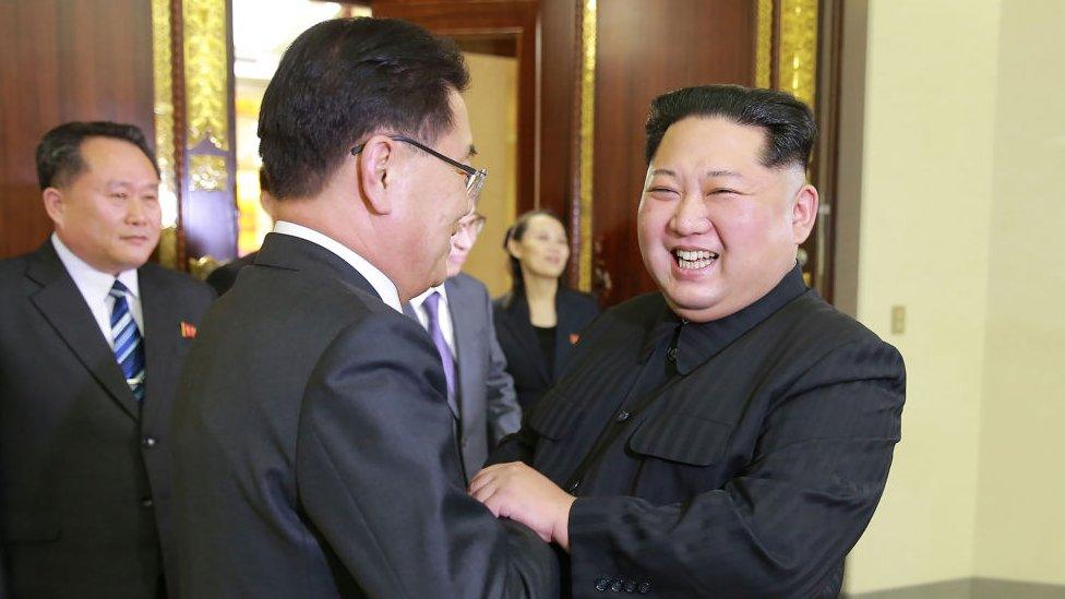 North Korean leader Kim Jong-Un (R) shaking hands with South Korean chief delegator Chung Eui-yong (C)