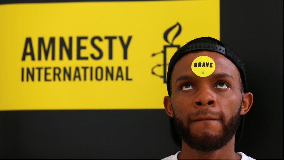 Human rights campaigner looks on during the release of an Amnesty International report in Abuja, Nigeria May 16, 2017