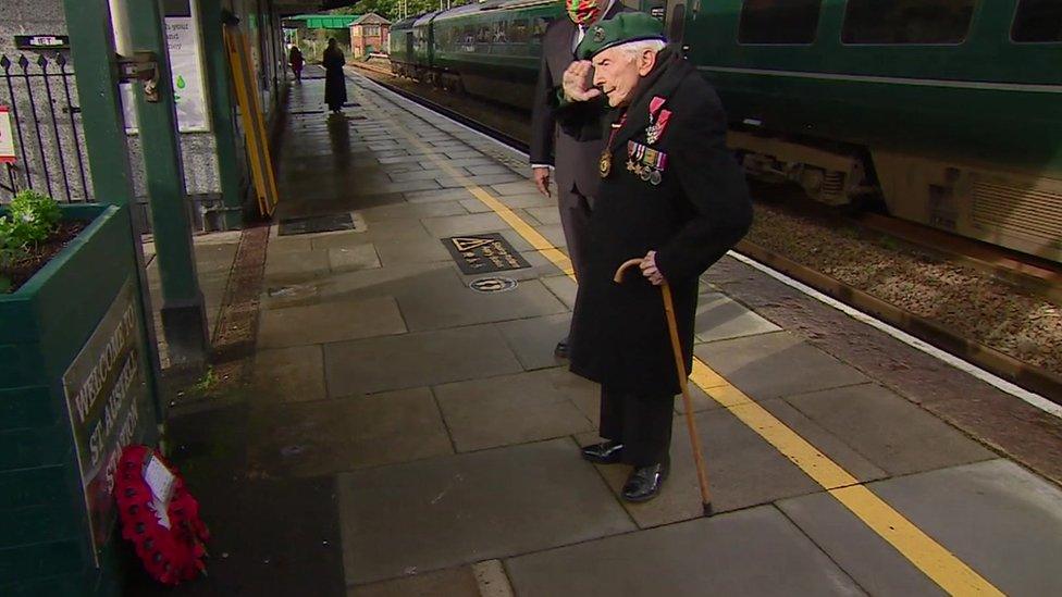 Harry Billinge salutes wreath at St Austell