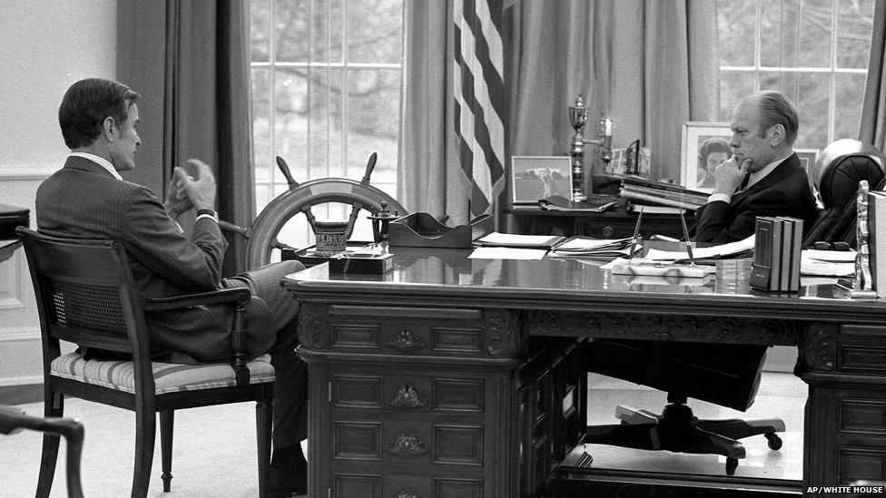 This White House file photograph shows President Ford, right, as he meets with then Central Intelligence Agency Director-designate George HW Bush in the Oval Office, December 17, 1975.